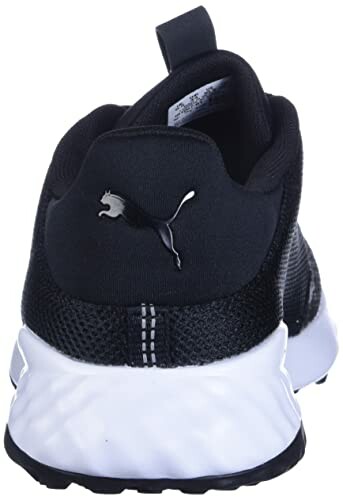 Back view of black sneaker with white sole.