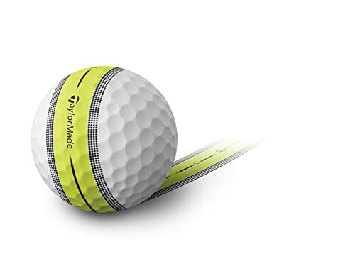 Golf ball with yellow stripe and TaylorMade logo.