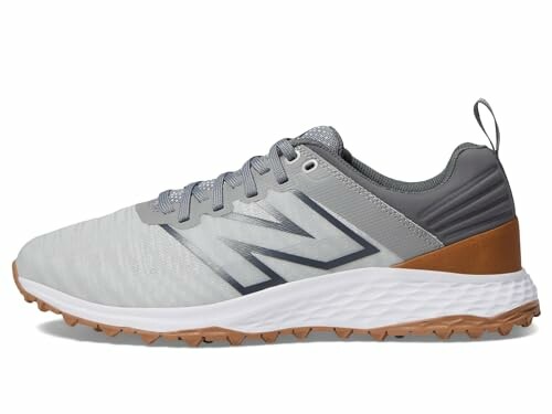 Gray athletic shoe with brown and white accents