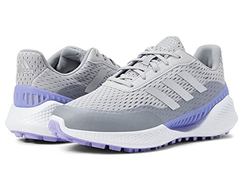 Gray and purple running sneakers with mesh design.