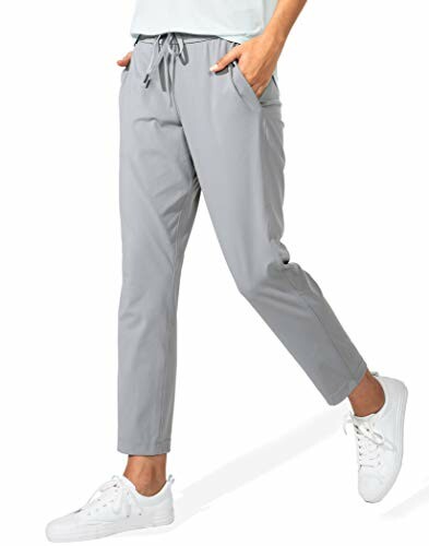 Woman wearing grey jogger pants with white sneakers