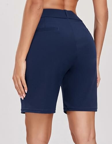 Back view of person wearing navy bike shorts.