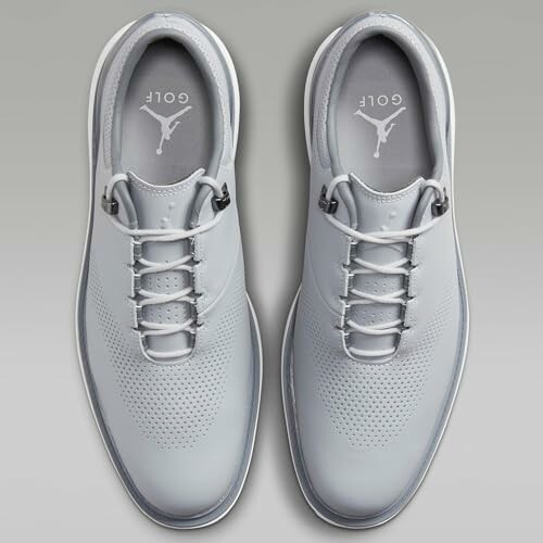 Top view of gray Nike golf shoes with logo