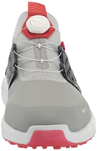 Front view of a gray and red Puma golf shoe with a unique lacing system.