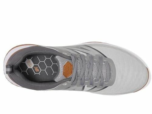 New Balance Men's Fresh Foam Contend V2 Golf Shoe - Top view of a gray sneaker with hexagonal pattern insole.