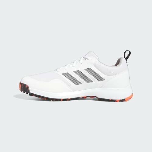 adidas mens Tech Response Spikeless 3.0 Golf Shoes - Top view of white sneakers with black stripes and orange accents on a light background