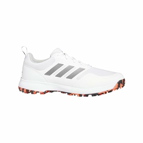 adidas mens Tech Response Spikeless 3.0 Golf Shoes - White and orange sports shoe with black stripes and rugged sole