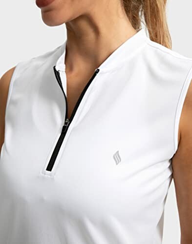 Woman in white sleeveless top with zipper.